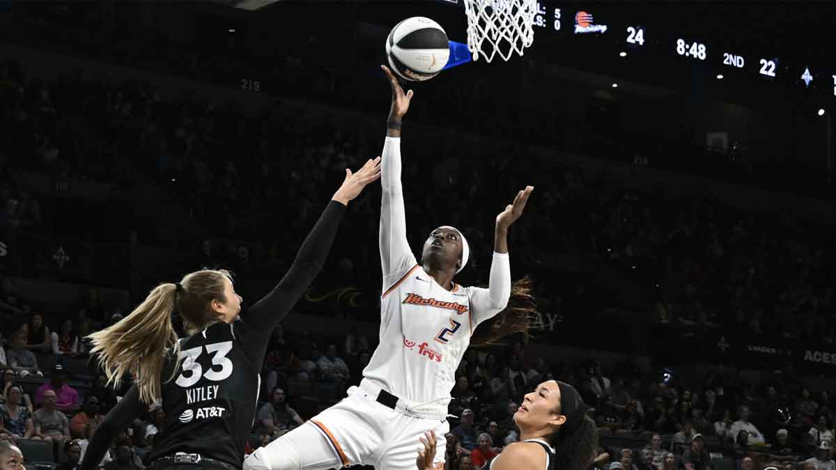 Phoenix Mercury guard Kahleah Copper (2) shoots against Las Vegas Aces center Elizabeth Kitley (33) and guard Aaliyah Nye (13) in the second quarter at Michelob Ultra Arena