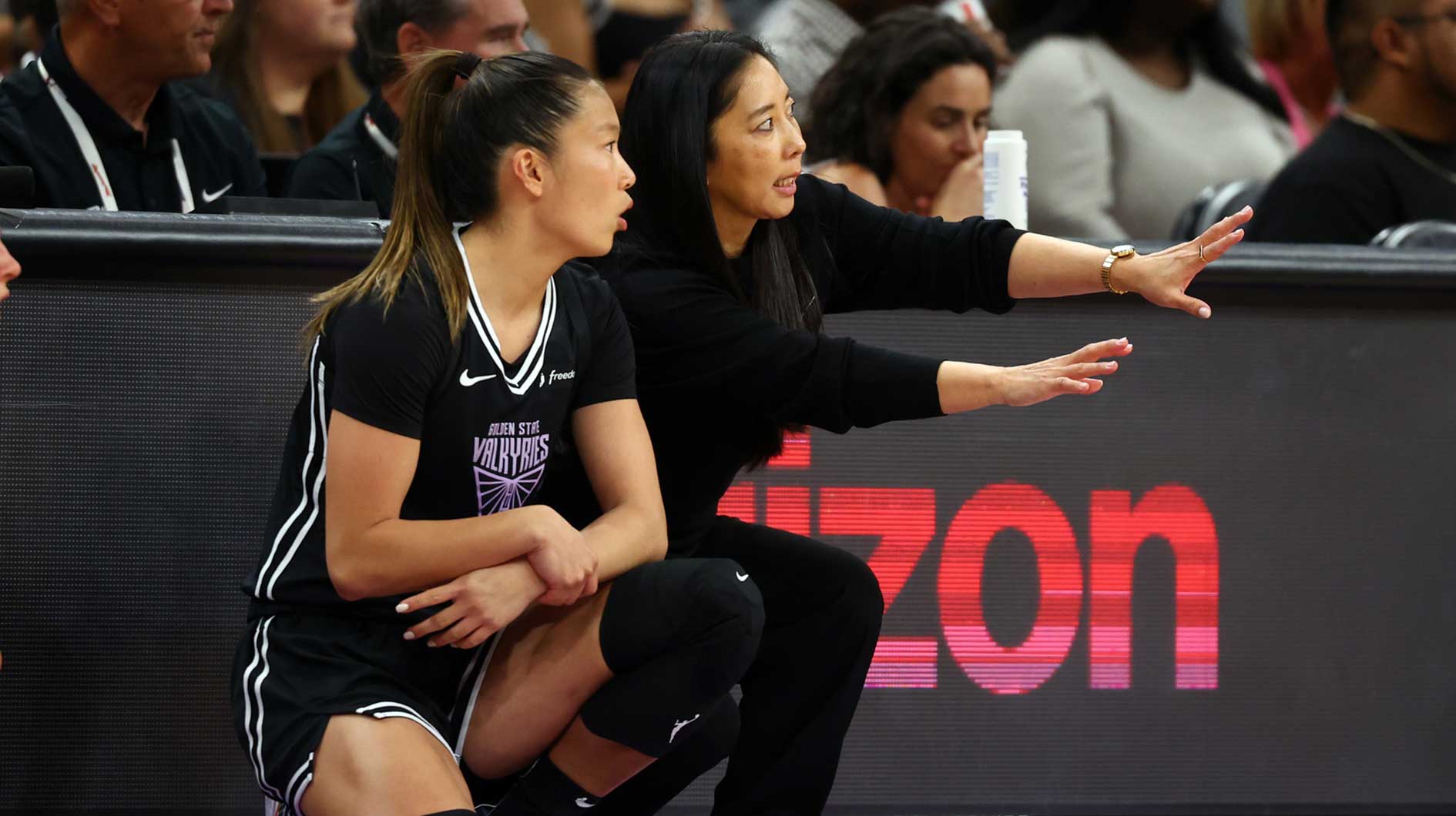 Golden State Valkyries head coach Natalie Nakase (right) with guard Kaitlyn Chen against the Phoenix Mercury during a preseason game at PHX Arena.