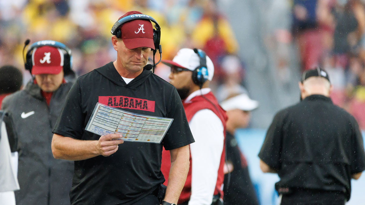 Alabama Crimson Tide head coach Kalen DeBoer reads the playcard against the Michigan Wolverines during the first half at Raymond James Stadium. Mandatory Credit: Matt Pendleton-Imagn Images