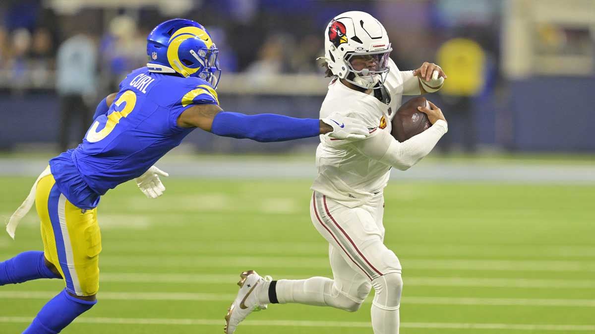Arizona Cardinals quarterback Kyler Murray (1) is chased down by Los Angeles Rams safety Kamren Curl (3) in the first half at SoFi Stadium.