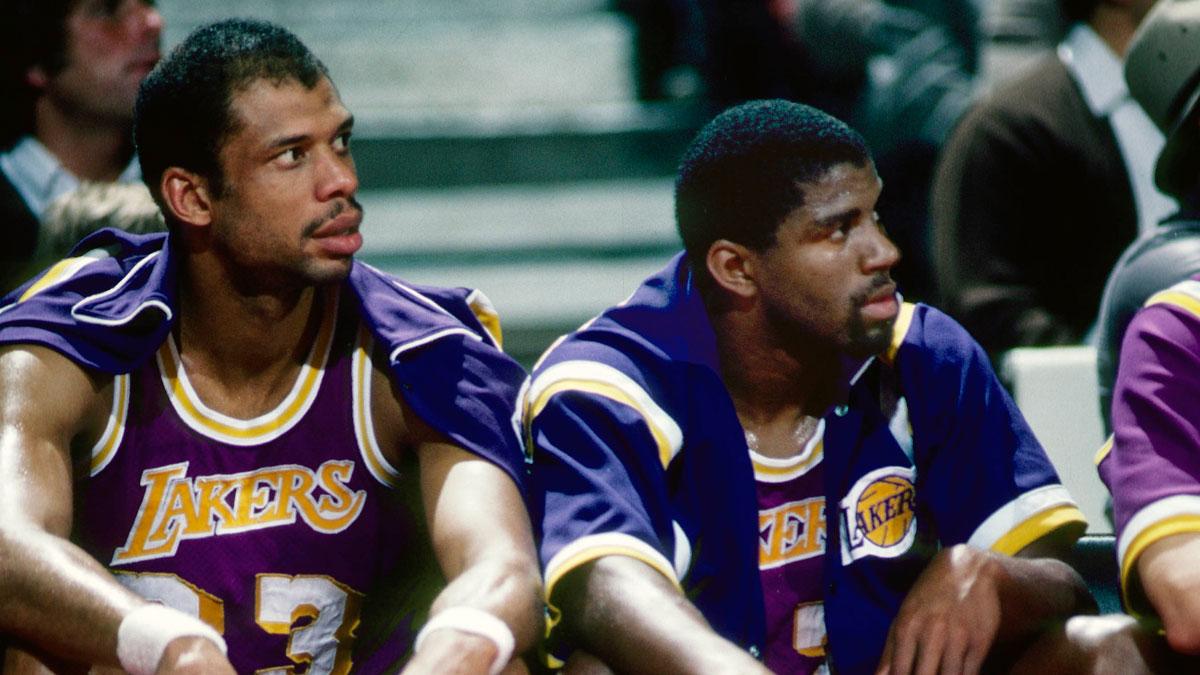 Los Angeles Lakers center Kareem Abdul-Jabbar (33) and Magic Johnson (32) on the bench against the Portland Trail Blazers at Memorial Coliseum.