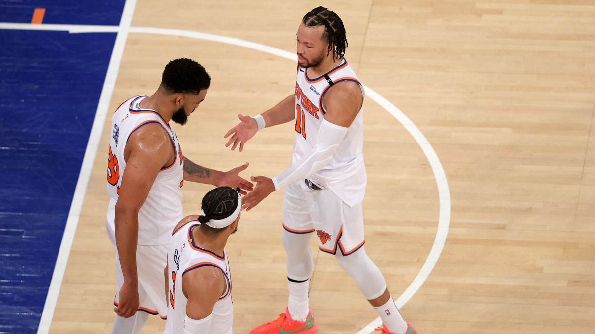 New York Knicks guard Jalen Brunson (11) and center Karl-Anthony Towns (32) and guard Josh Hart (3) react in the fourth quarter against the Indiana Pacers during game five of the eastern conference finals for the 2025 NBA Playoffs at Madison Square Garden.