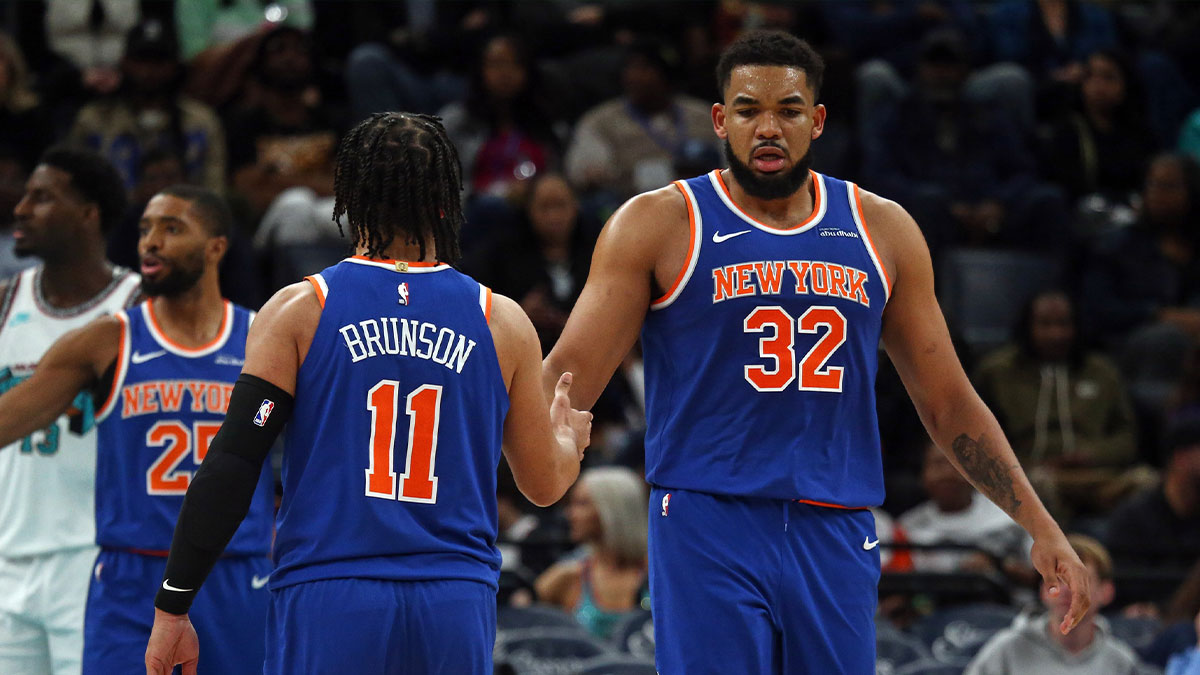 New York Knicks center Karl-Anthony Towns (32) reacts with guard Jalen Brunson (11) during the third quarter against the Memphis Grizzlies at FedExForum.