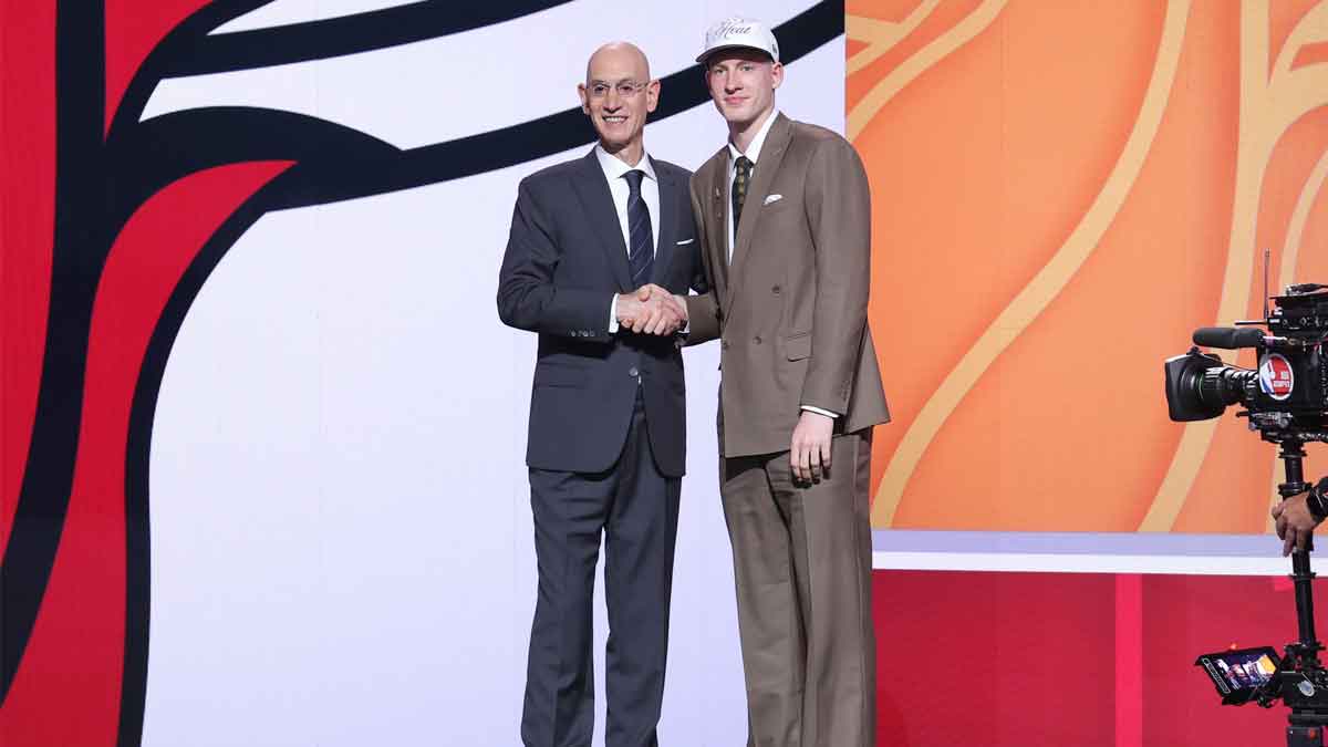 Kasparas Jakucionis stands with NBA commissioner Adam Silver after being selected as the 20th pick by the Miami Heat in the first round of the 2025 NBA Draft at Barclays Center.