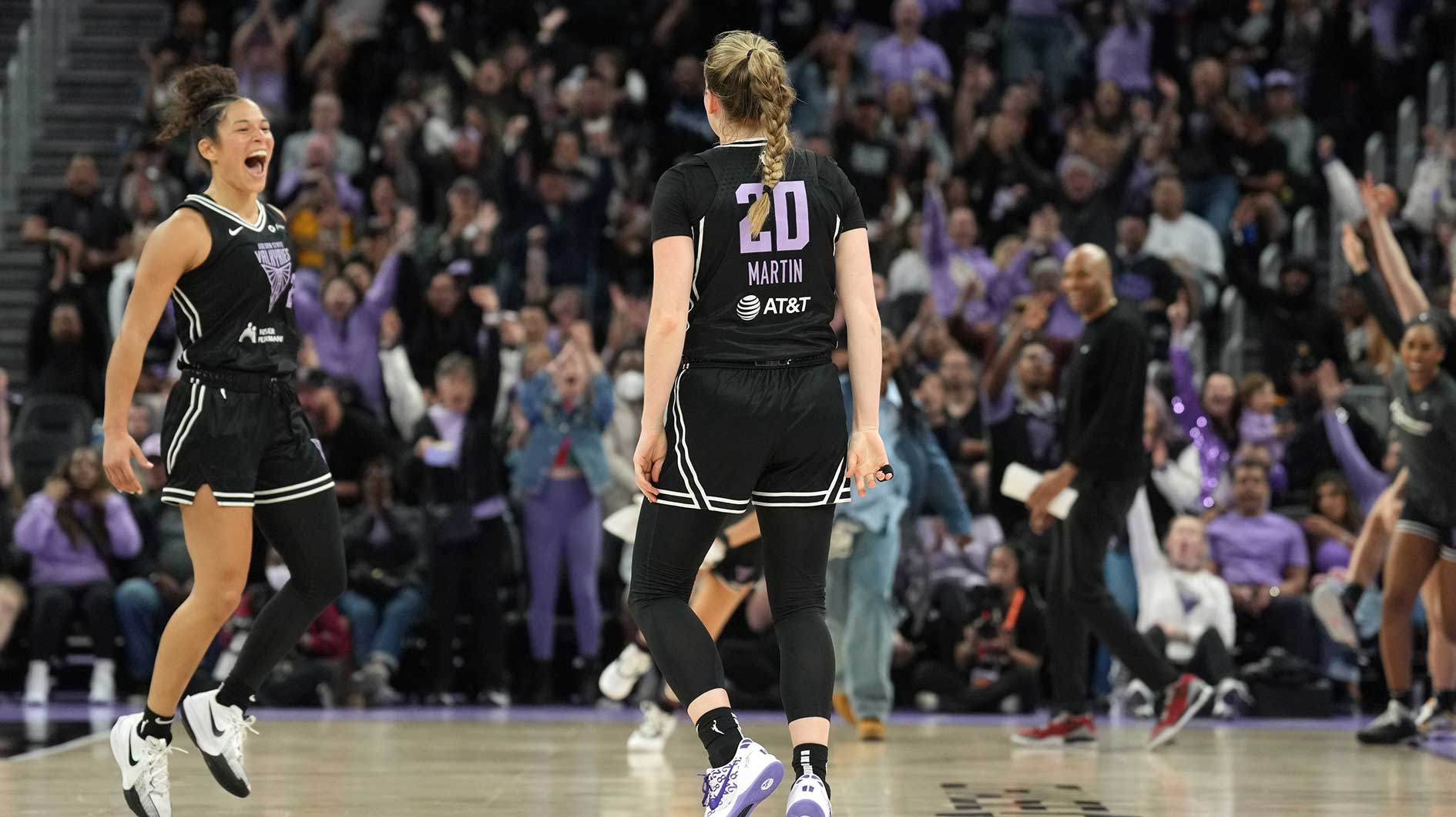 Golden State Valkyries guard Kate Martin (20) reacts with guard Veronica Burton (left) after making a three point basket against the Las Vegas Aces to end the second quarter at Chase Center.