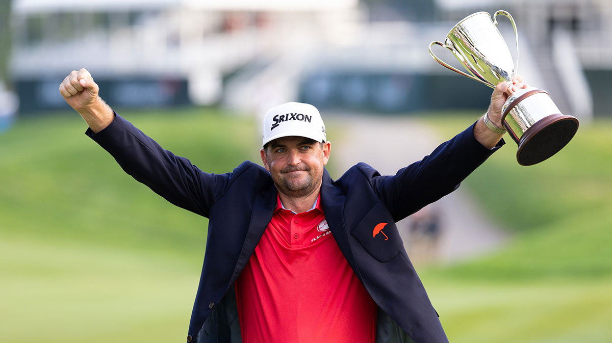 Keegan Bradley raises the Travelers Championship trophy after winning the Travelers Championship golf tournament.