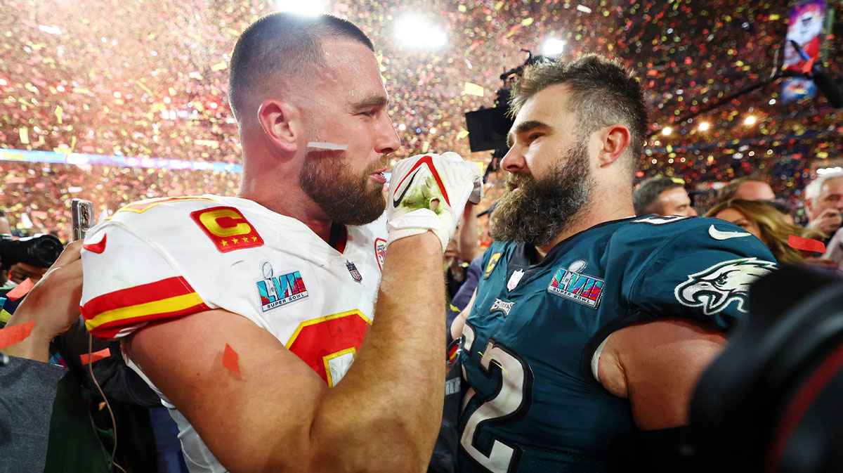 Kansas City Chiefs tight end Travis Kelce (87) talks with his brother Philadelphia Eagles center Jason Kelce (62) after he won Super Bowl LVII at State Farm Stadium.