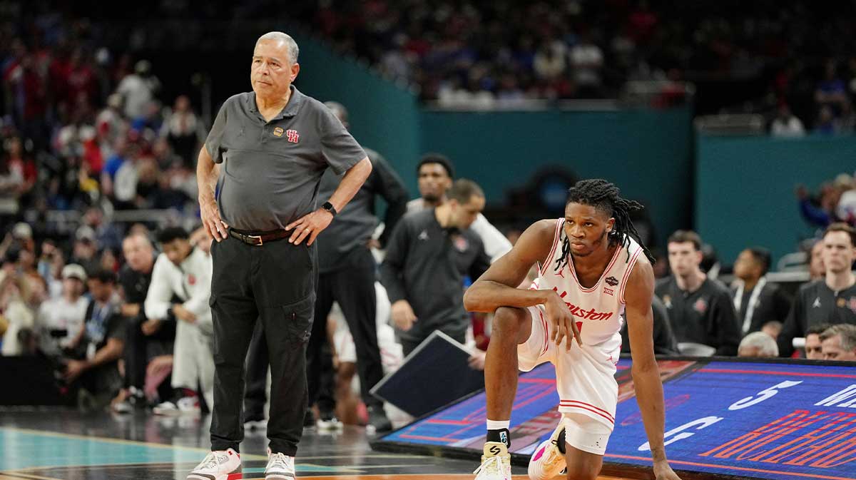Houston Cougars head coach Kelvin Sampson and forward Joseph Tugler (11) look on against the Florida Gators during the second half of the national championship game of the Final Four of the 2025 NCAA Tournament at the Alamodome.