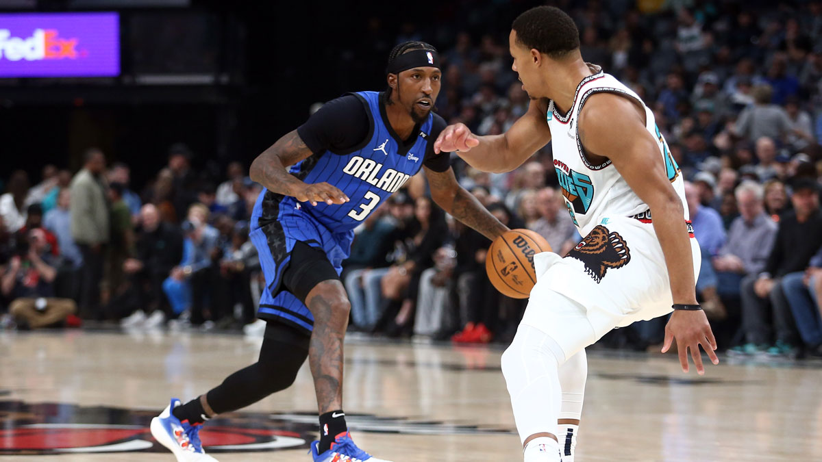 Orlando Magic guard Kentavious Caldwell-Pope (3) shoots as Memphis Grizzlies guard Desmond Bane (22) defends during the first half at FedExForum.