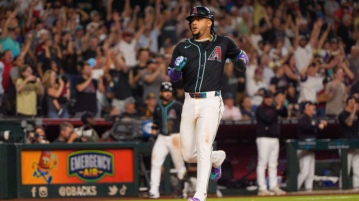 Jun 14, 2025; Phoenix, Arizona, USA; Arizona Diamondbacks infielder Ketel Marte (4) scores in the ninth inning against the San Diego Padres at Chase Field.