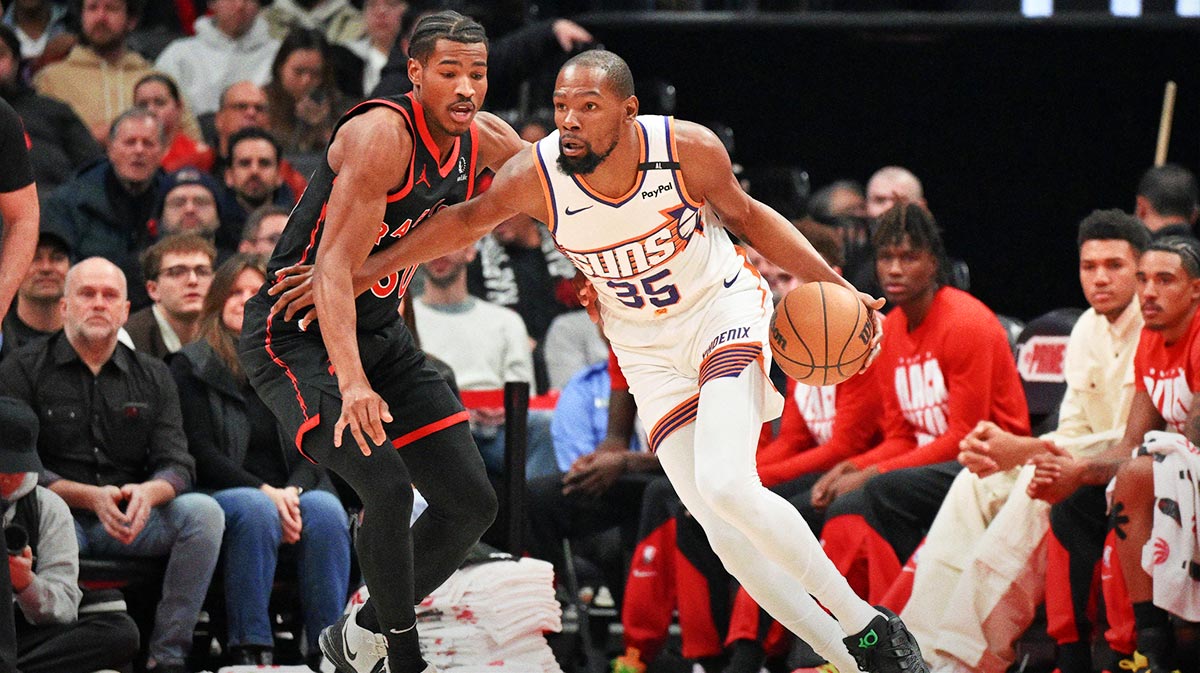 Phoenix Suns forward Kevin Durant (35) drives toward the basket against Toronto Raptors guard Ochai Agbaji (30) in the first half at Scotiabank Arena.