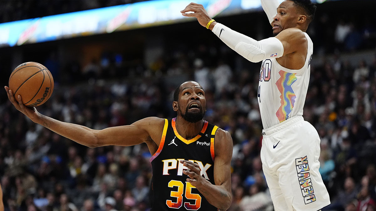 Denver Nuggets guard Russell Westbrook (4) defends on Phoenix Suns forward Kevin Durant (35)in the first quarter at Ball Arena.