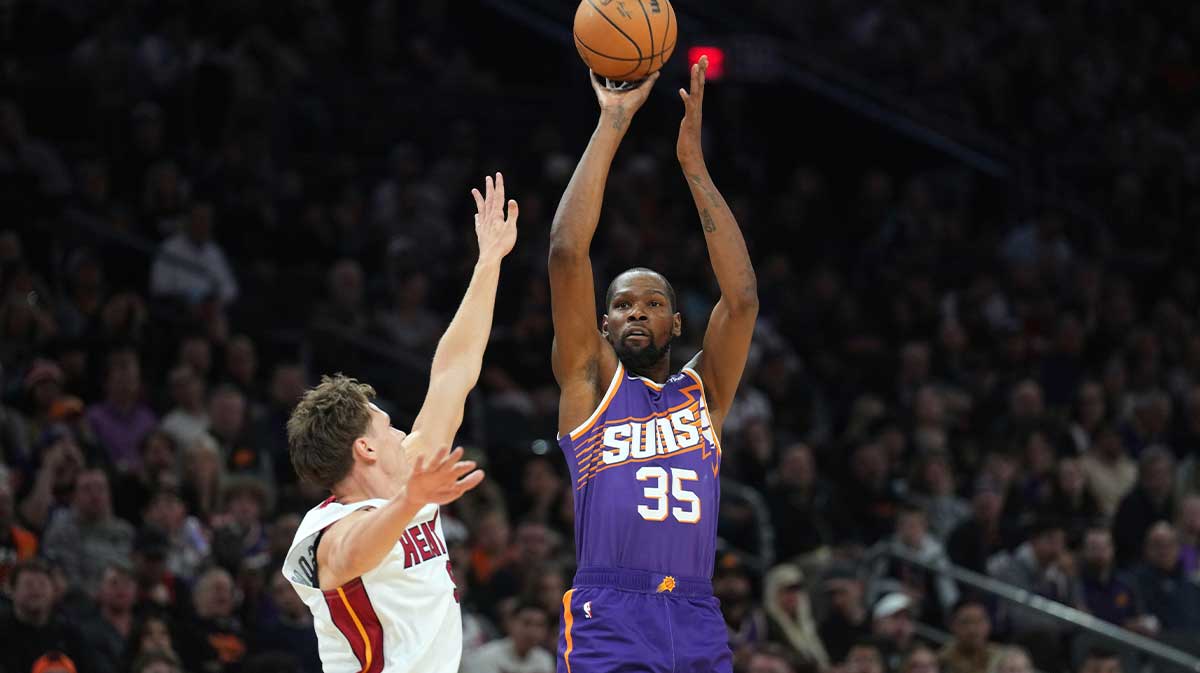 Phoenix Suns forward Kevin Durant (35) shoots over Miami Heat guard Pelle Larsson (9) during the first half at Footprint Center.