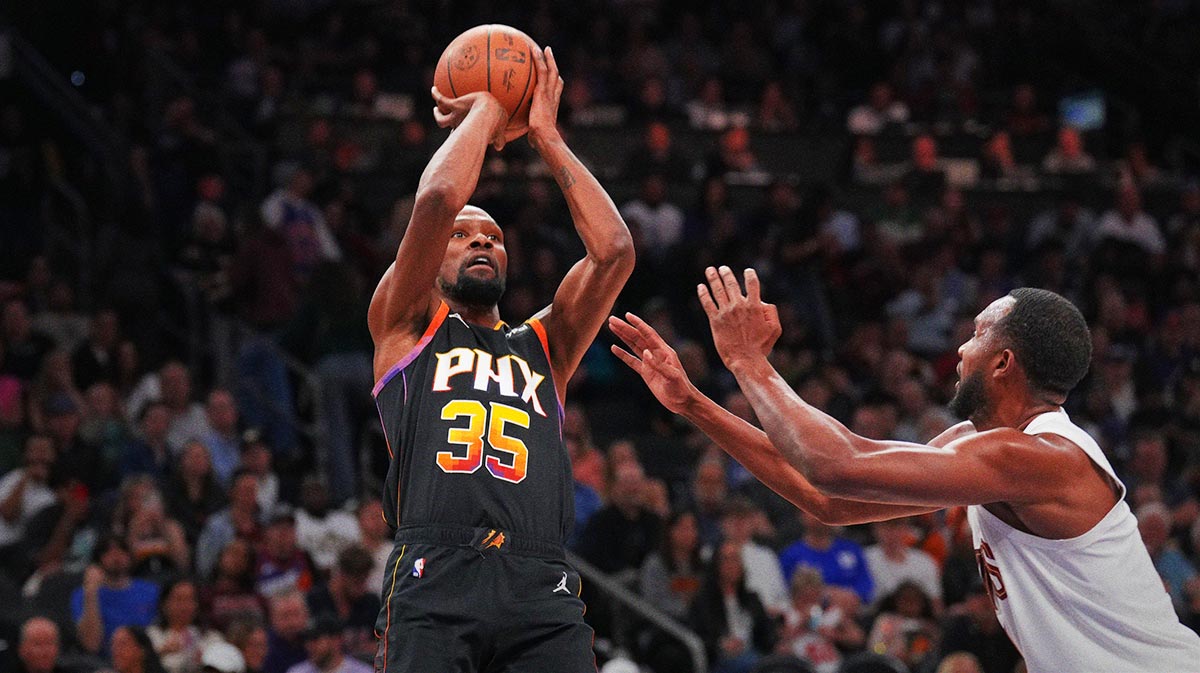 Phoenix Suns forward Kevin Durant (35) shoots against Cleveland Cavaliers forward Evan Mobley (4) during the second half at Footprint Center.