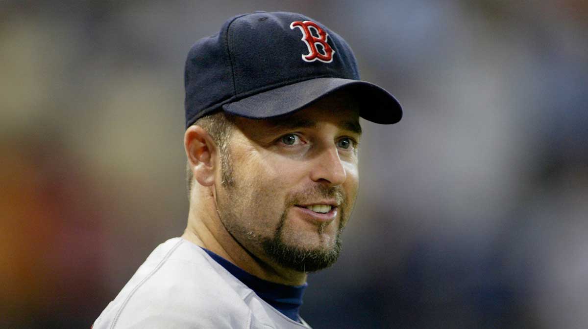 Boston Red Sox first baseman #15 Kevin Millar smiles as he goes back out on the field even though his team is losing to the Minnesota Twins at the Metrodome. Twins won 12-0.