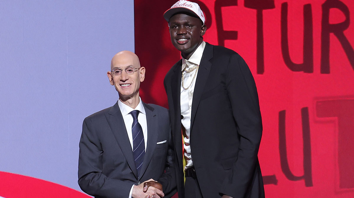 Jun 25, 2025; Brooklyn, NY, USA; Khaman Maluach stands with NBA commissioner Adam Silver after being selected as the tenth pick by the Houston Rockets in the first round of the 2025 NBA Draft at Barclays Center.