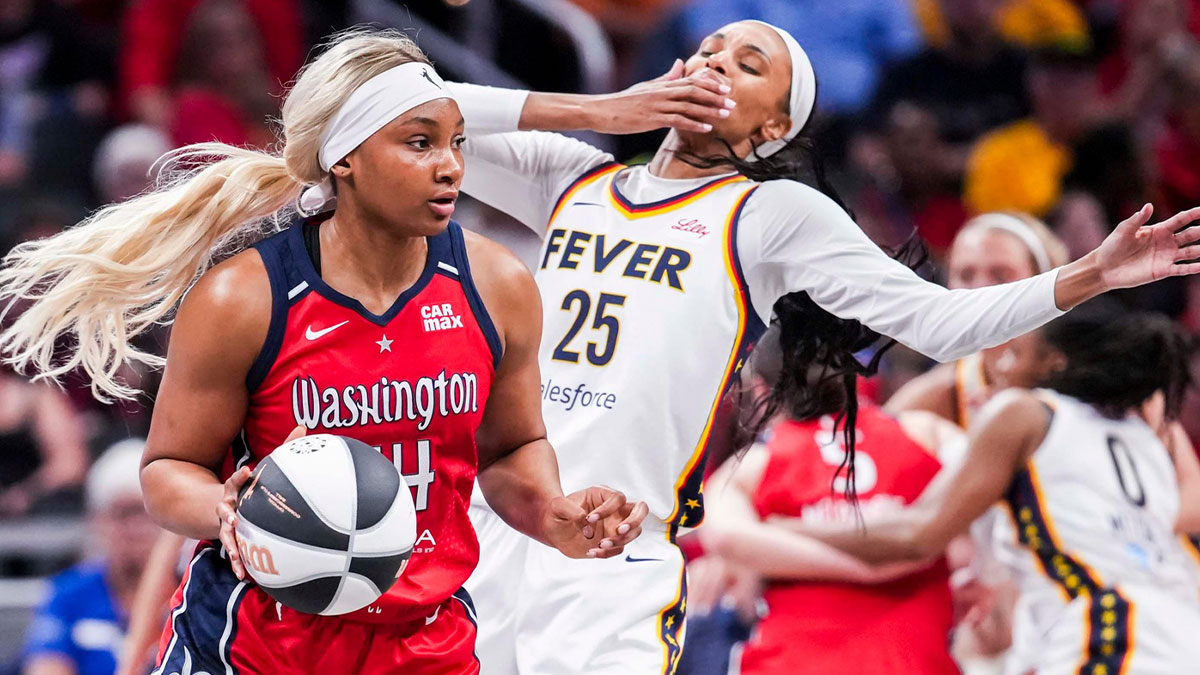 Indiana Fever forward DeWanna Bonner (25) falls back while guarding Washington Mystics forward Kiki Iriafen (44) on Tuesday, June 3, 2025, during a game between the Indiana Fever and the Washington Mystics at Gainbridge Fieldhouse in Indianapolis.