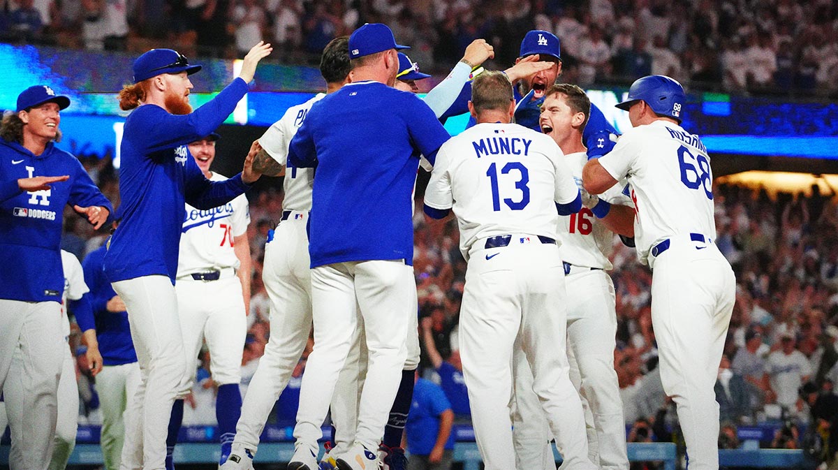 Jun 18, 2025; Los Angeles, California, USA; Los Angeles Dodgers catcher Will Smith (16) celebrates with third baseman Max Muncy (13), first baseman Freddie Freeman (5) and catcher Dalton Rushing (68) after hitting a walkoff home run against the San Diego Padres at Dodger Stadium. Mandatory Credit: Kirby Lee-Imagn Images