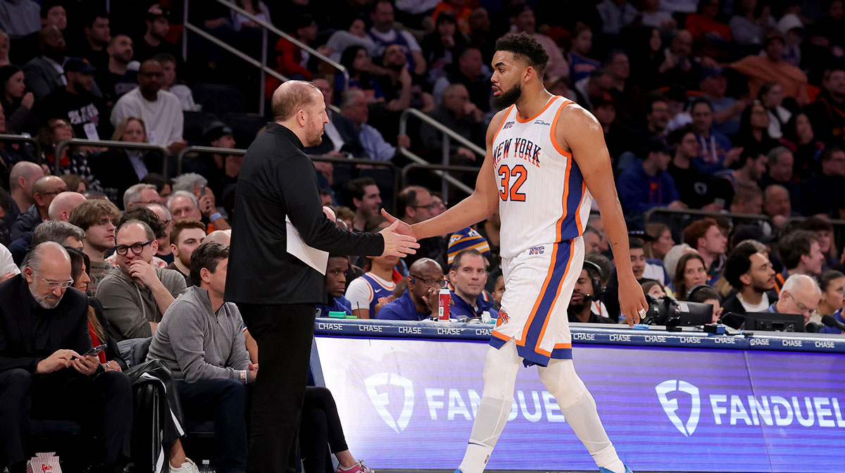 New York Knicks center Karl-Anthony Towns (32) shakes hands with New York Knicks head coach Tom Thibodeau as he exits the game during the third quarter against the Oklahoma City Thunder at Madison Square Garden.