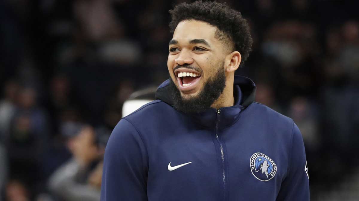 Mar 5, 2022; Minneapolis, Minnesota, USA; Minnesota Timberwolves center Karl-Anthony Towns (32) laughs before the game with the Portland Trail Blazers at Target Center.