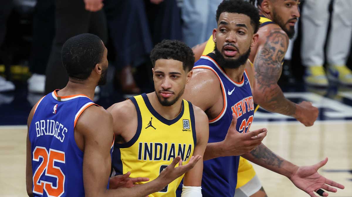 New York Knicks center Karl-Anthony Towns (32) and forward Mikal Bridges (25) speak in the fourth quarter during game six of the eastern conference finals against the Indiana Pacers for the 2025 NBA Playoffs at Gainbridge Fieldhouse.