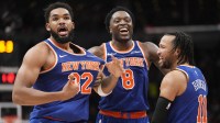 New York Knicks guard Jalen Brunson (11) and forward OG Anunoby (8) react after a three point basket by center Karl-Anthony Towns (32) to clinch a win over the Toronto Raptors during the second half at Scotiabank Arena.