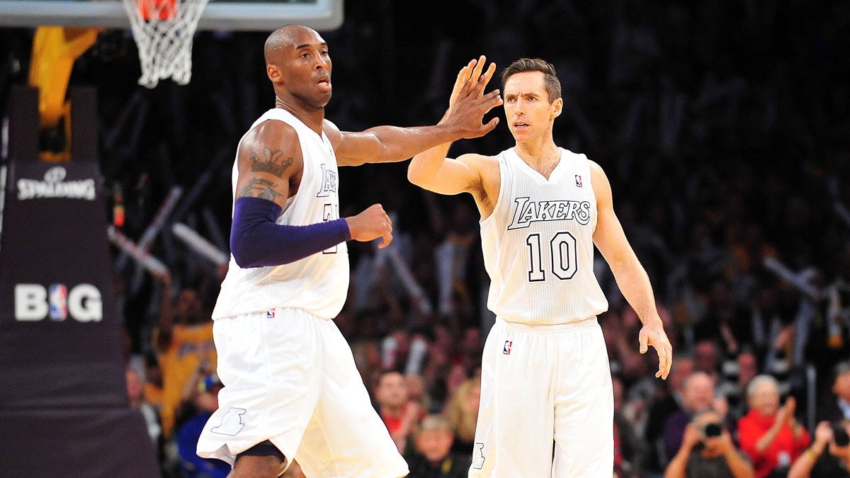 Los Angeles Lakers shooting guard Kobe Bryant (24) and point guard Steve Nash (10) react following a scoring play against the New York Knicks during the second half at Staples Center.