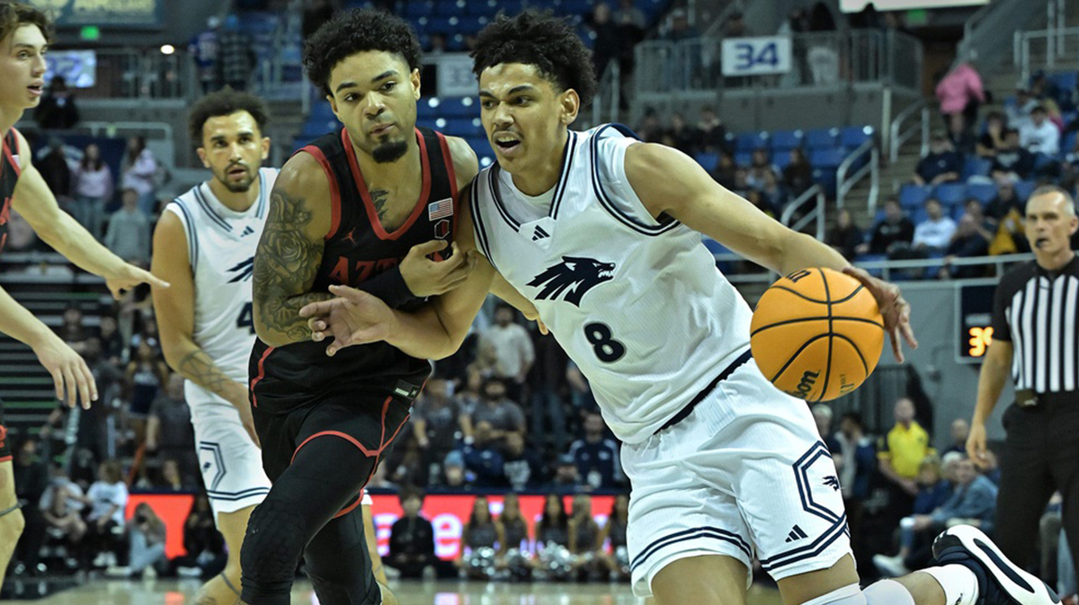 Nevada’s Kobe Sanders drives ball against San Diego's Nick Boyd in the second half of Saturday's game at Lawlor Events Center on Jan. 25, 2025.