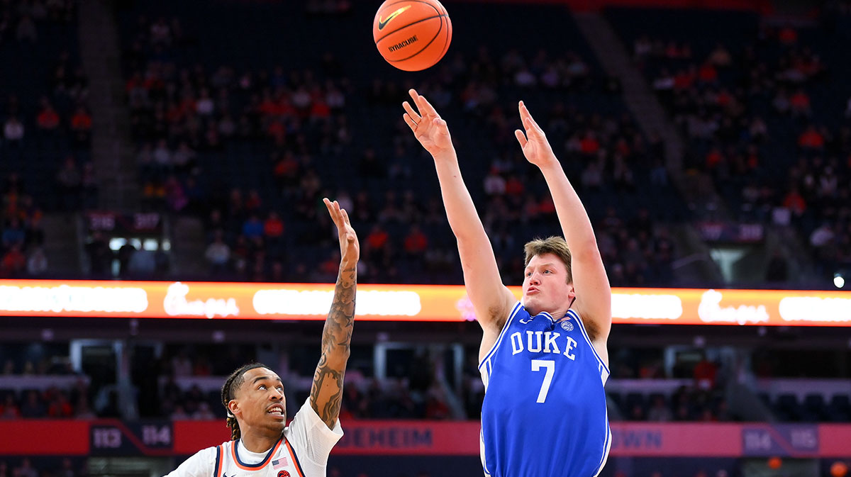Duke Blue Devils guard Kon Knueppel (7) shoots against Syracuse Orange guard Lucas Taylor (3) during the first half at the JMA Wireless Dome.