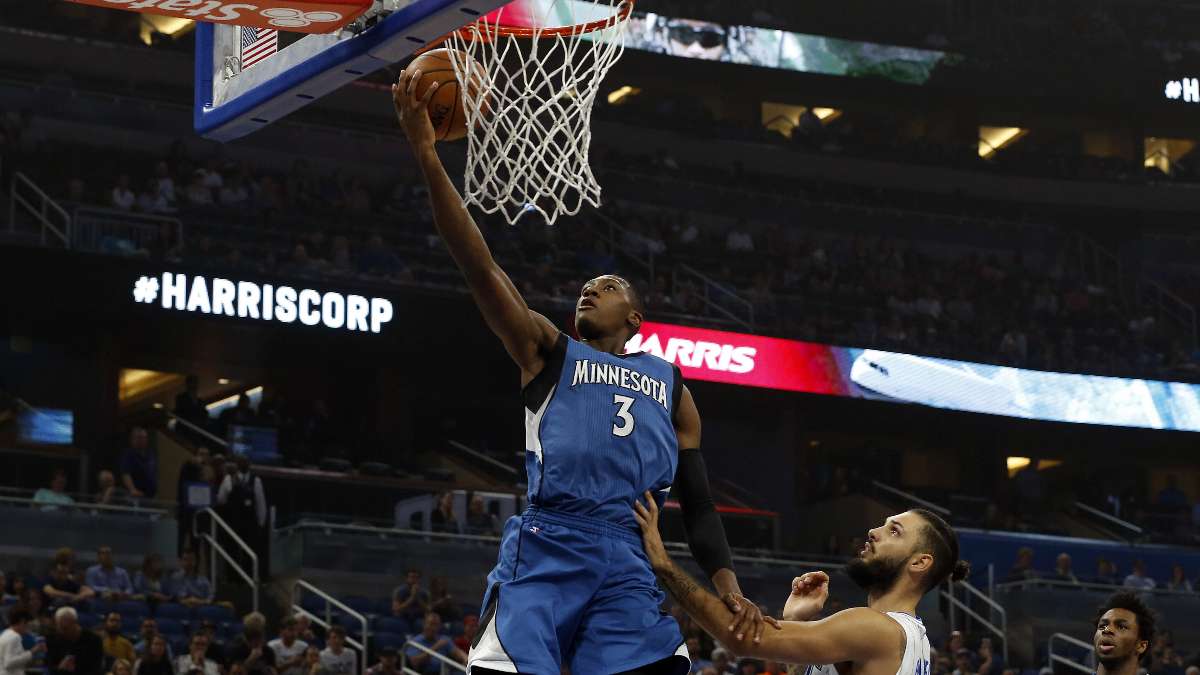 Minnesota Timberwolves guard Kris Dunn (3) shoots over Orlando Magic guard Evan Fournier (10) during the first quarter at Amway Center.