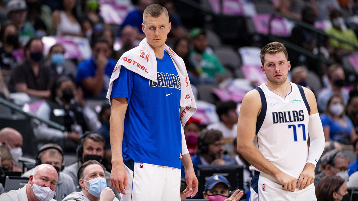 Dallas Mavericks center Kristaps Porzingis (6) and guard Luka Doncic (77) watch their team take on the Utah Jazz during the first half at the American Airlines Center.