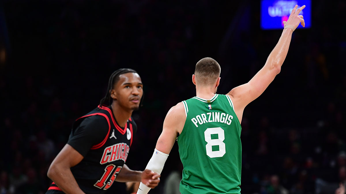 Boston Celtics center Kristaps Porzingis (8) reacts after making a three point basket during the second half against the Chicago Bulls at TD Garden.