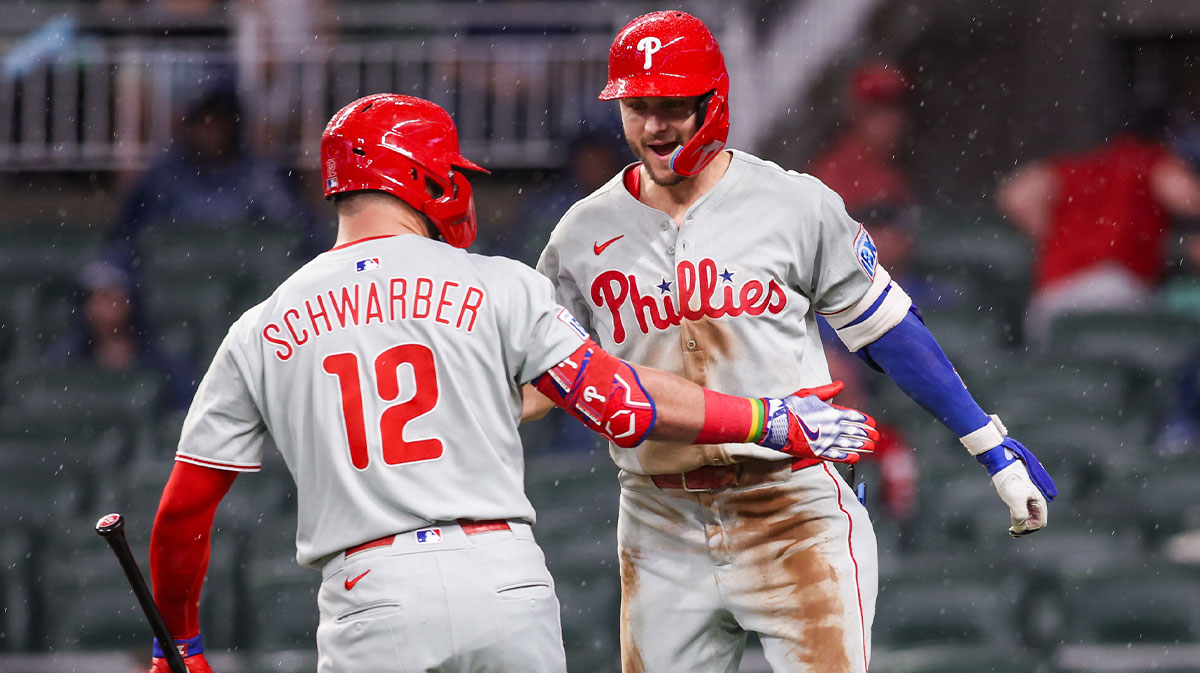 Jun 27, 2025; Atlanta, Georgia, USA; Philadelphia Phillies shortstop Trea Turner (7) celebrates with designated hitter Kyle Schwarber (12) after a home run against the Atlanta Braves in the second inning at Truist Park. M