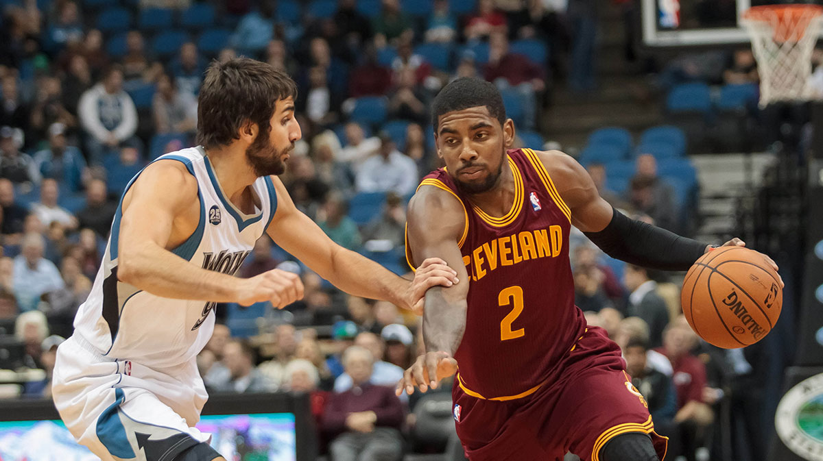 Minnesota Timberwolves point guard Ricky Rubio (9) guards Cleveland Cavaliers point guard Kyrie Irving (2) in the first quarter at Target Center.
