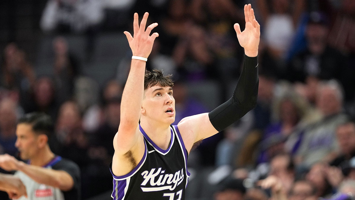 Sacramento Kings forward Jake LaRavia (33) gestures after making a three point basket against the Milwaukee Bucks during the second quarter at Golden 1 Center.