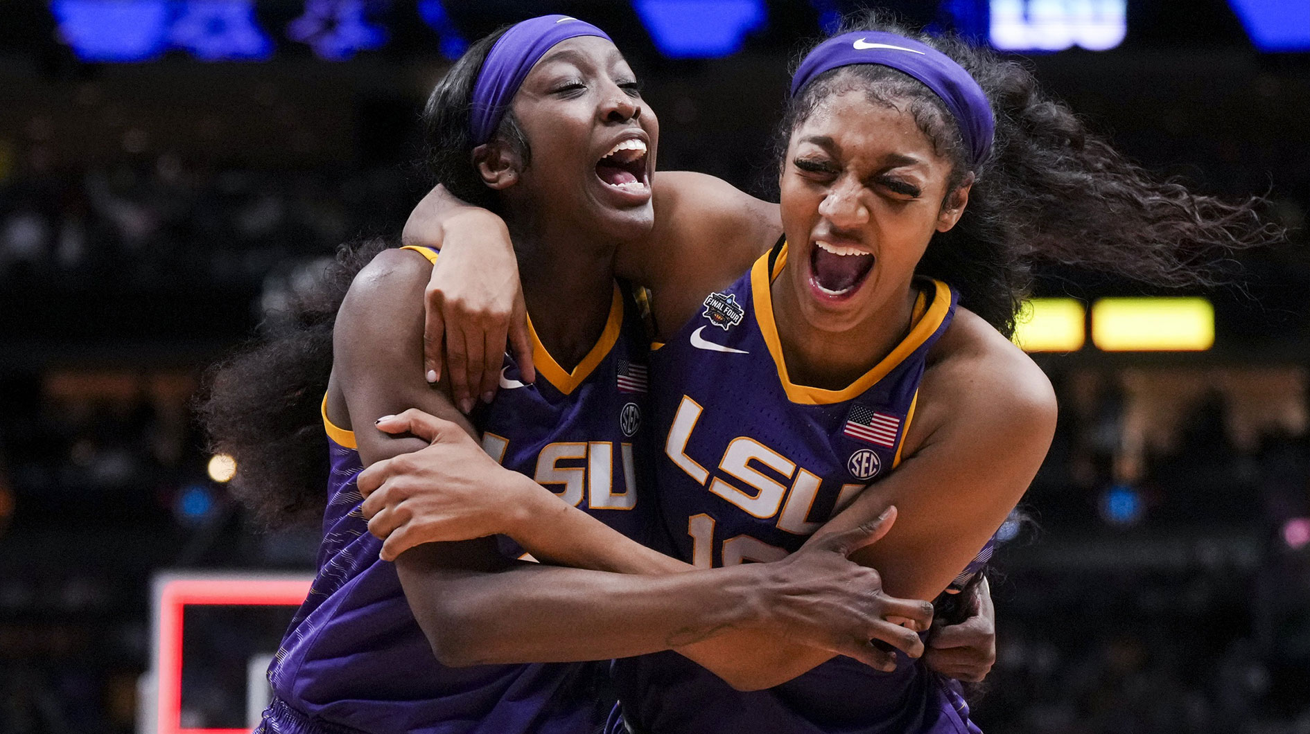 LSU Lady Tigers guard Flau'jae Johnson, left, celebrates with forward Angel Reese after defeating the Virginia Tech Hokies in semifinals of the women's Final Four of the 2023 NCAA Tournament.