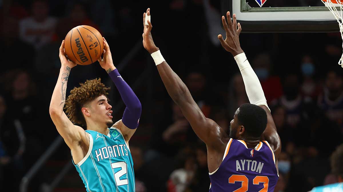 Charlotte Hornets guard LaMelo Ball (2) against Phoenix Suns center Deandre Ayton (22) at Footprint Center.