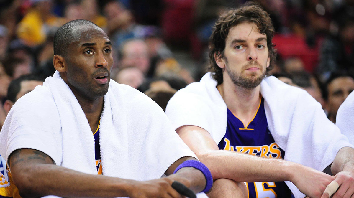 Lakers guard Kobe Bryant (left) and forward Pau Gasol (right) rest on the bench during the second quarter against the Sacramento Kings at Arco Arena. The Lakers defeated the Kings 112-103 in double overtime with Dwyane Wade in the background