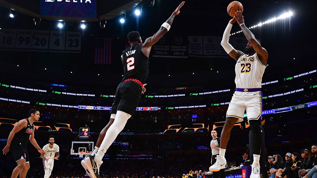 Lakers' LeBron James shoots over Blazers' Deandre Ayton