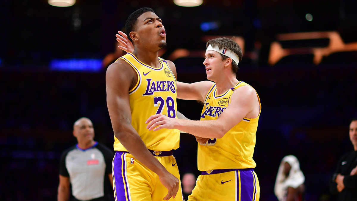 Lakers forward Rui Hachimura (28) reacts with guard Austin Reaves (15) after scoring a basket and drawing the foul against the Miami Heat during the second half at Crypto.com Arena