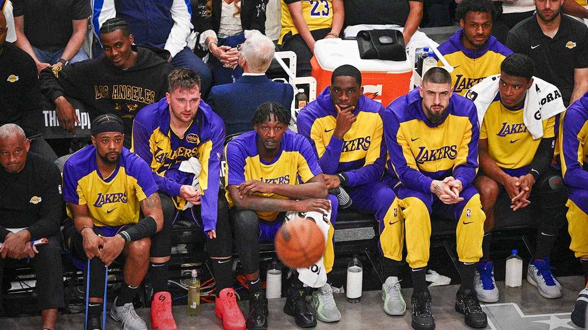 Los Angeles Lakers guard Luka Doncic (77) looks on from the team bench during the game between the Dallas Mavericks and the Los Angeles Lakers at American Airlines Center.