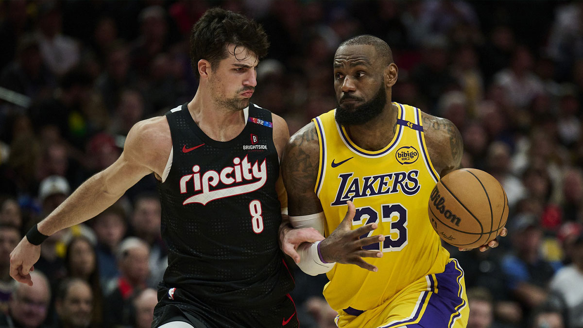 Los Angeles Lakers forward LeBron James (23) drives to the basket during the second half against Portland Trail Blazers forward Deni Avdija (8) at Moda Center.