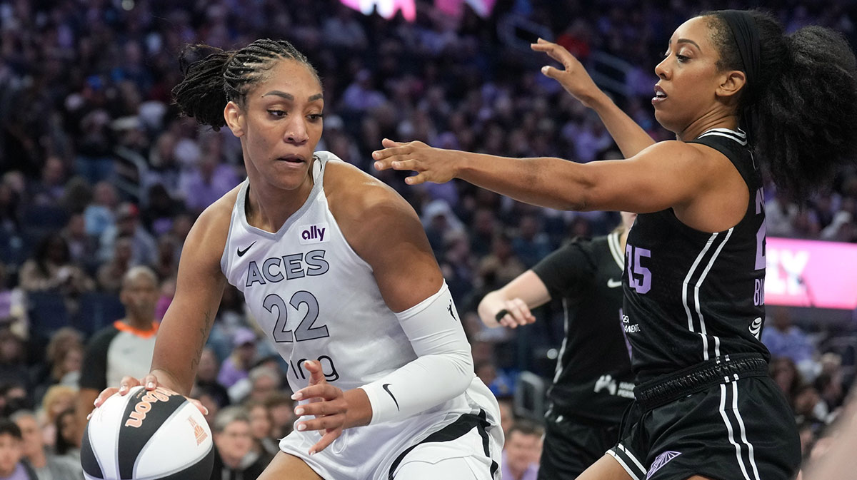 Las Vegas Aces center A'ja Wilson (22) dribbles against Golden State Valkyries forward Monique Billings (right) during the third quarter at Chase Center.