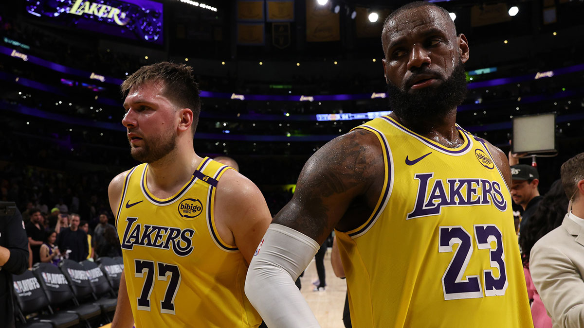 Los Angeles Lakers guard Luka Doncic (77) and Los Angeles Lakers forward LeBron James (23) leave a court after defeating the Minnesota Timberwolves 94-85 in game two of first round for the 2024 NBA Playoffs at Crypto.com Arena.
