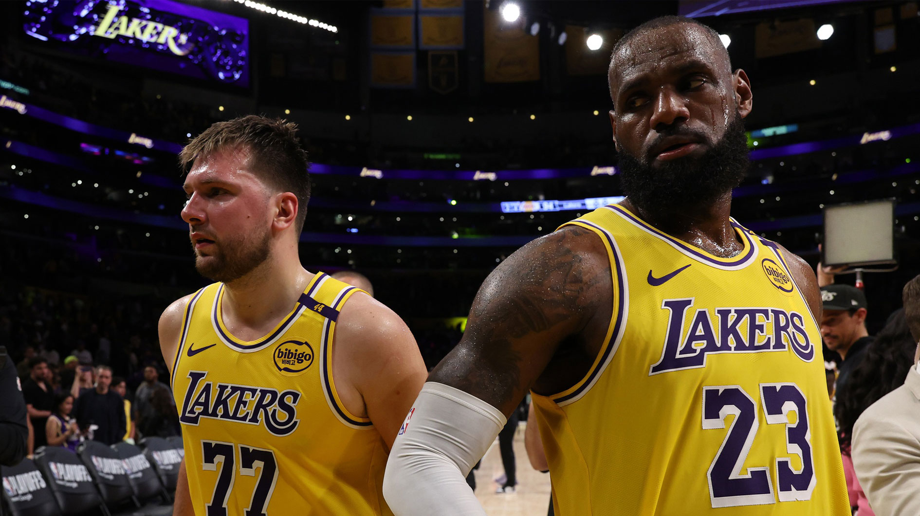 Los Angeles Lakers guard Luka Doncic (77) and Los Angeles Lakers forward LeBron James (23) leave a court after defeating the Minnesota Timberwolves 94-85 in game two of first round for the 2024 NBA Playoffs at Crypto.com Arena.