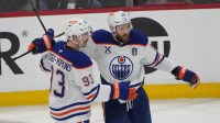 Edmonton Oilers center Ryan Nugent-Hopkins (93) celebrates scoring with center Leon Draisaitl (29) during the second period against the Florida Panthers in game four of the 2025 Stanley Cup Final at Amerant Bank Arena.