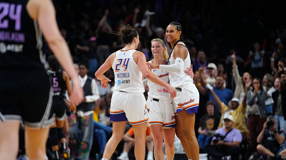 Mercury guard Lexi Held (1), forward Satou Sabally (0) and forward Kathryn Westbeld (24) celebrate a late lead against the Valkyries during a game at PHX Arena in Phoenix, on June 5, 2025.