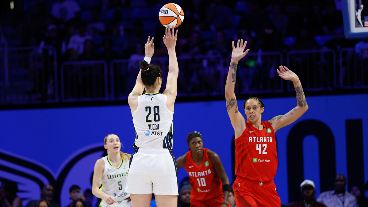 Dallas Wings center Li Yueru (28) scores a three-point basket against Atlanta Dream center Brittney Griner (42) during the first half at College Park Center.