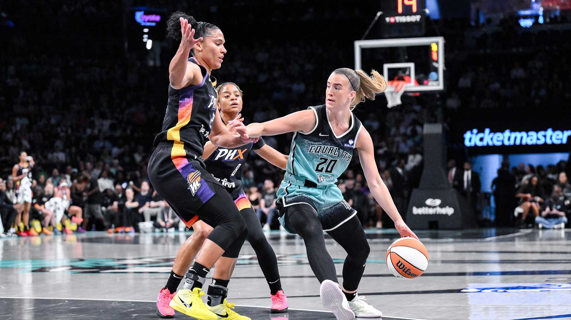 New York Liberty guard Sabrina Ionescu (20) sets the play while being defended by Phoenix Mercury forward Alyssa Thomas (25) and guard Monique Akoa Makani (8) during the first half at Barclays Center.