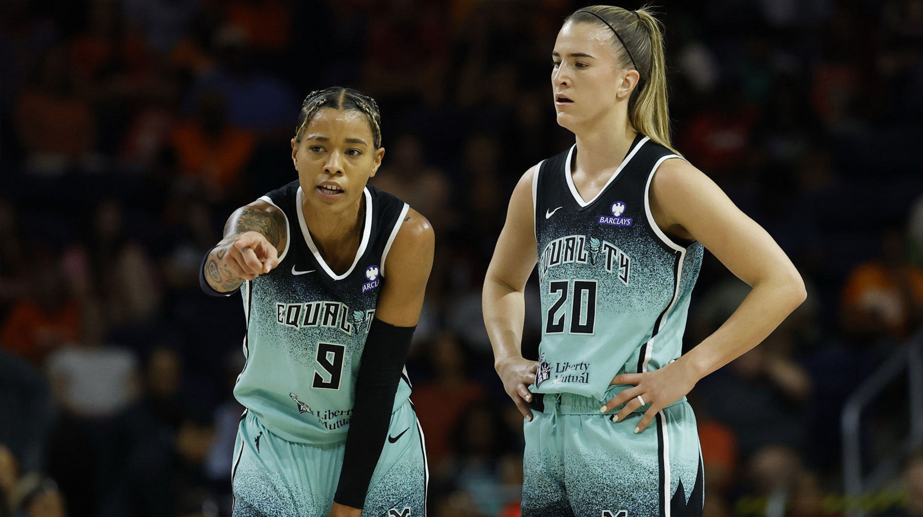 New York Liberty guard Natasha Cloud (9) talks with Liberty guard Sabrina Ionescu (20) against the Washington Mystics in the first half at Entertainment & Sports Arena. 